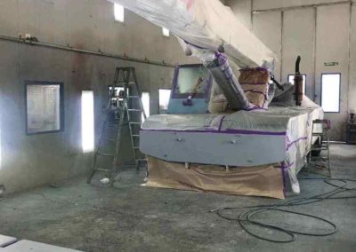 This photo of a boom crane demonstrates just how big this one of three Simpson Crash spray painting booth is in both height and depth